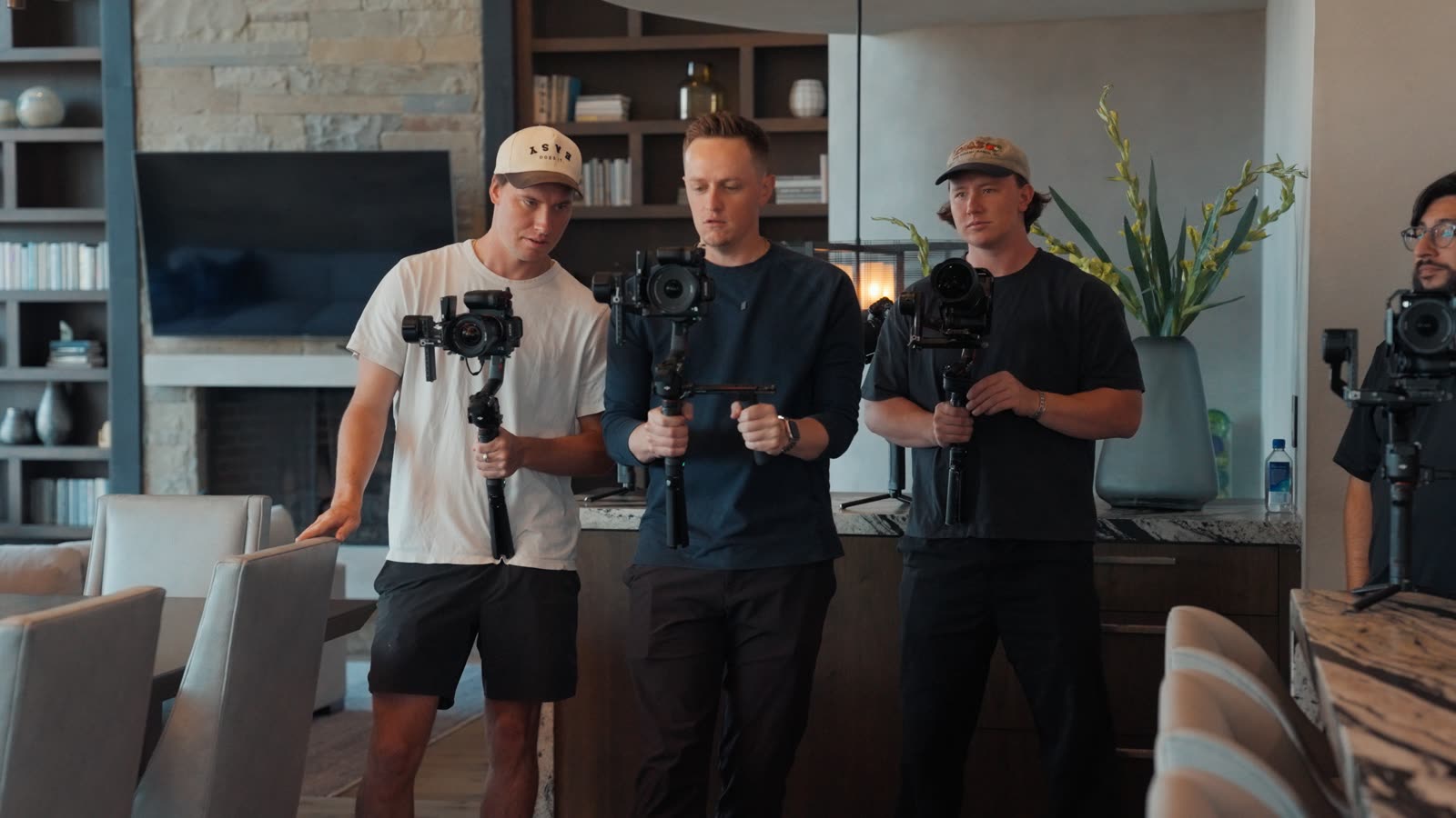 Three videographers practicing gimbal moves