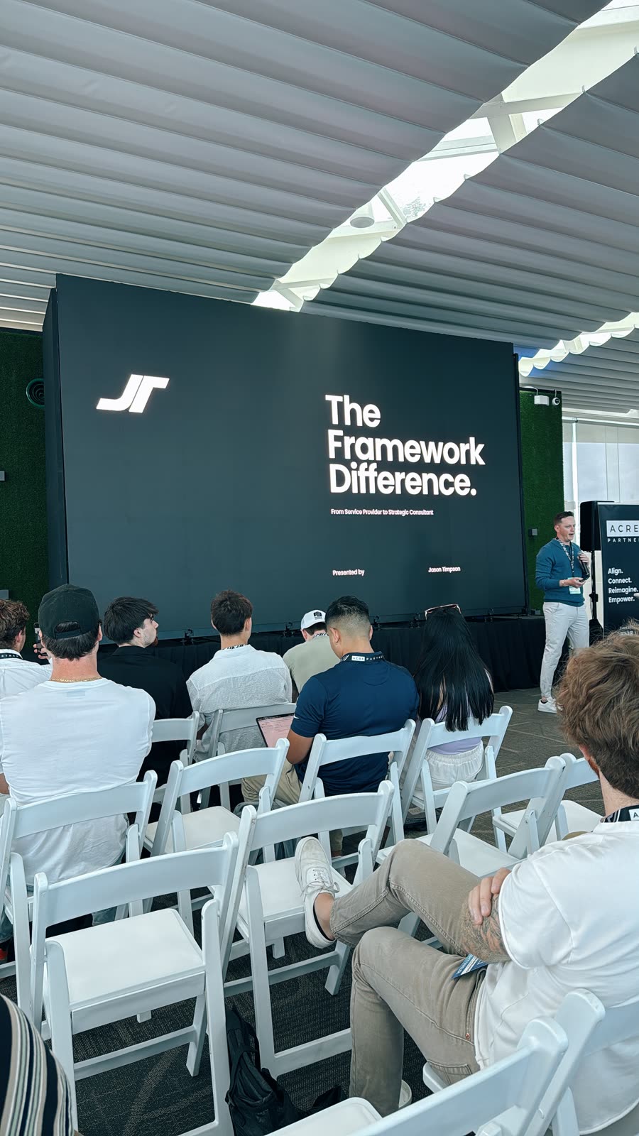 JT presenting on stage in Cancún